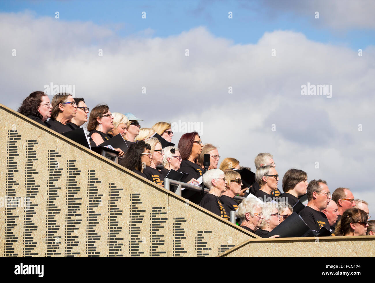 Stockton International Riverside Festival, Stockton on Tees, England. United Kingdom. 2nd August, 2018. Rehearsals for 'This is not for you', a performance paying tribute to Britain`s wounded war veterans, men and woman. The piece is performed by Blesma, (The Limbless Veterans), professional performers and local community choirs. The piece will be performed 3 times during the festival. PICTURED: local community choir in rehearsals on open air stage. The festival runs from 2nd - 5th August Credit: ALAN DAWSON/Alamy Live News Stock Photo